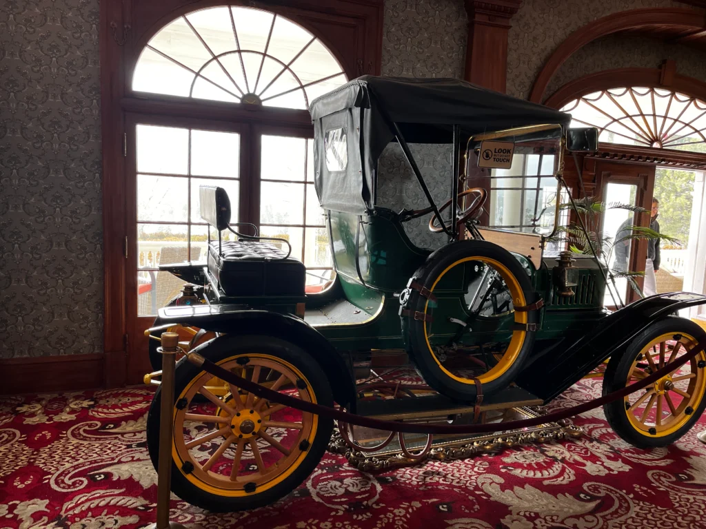 An old Stanley Steamer car sits in the lobby of the Stanley Hotel.