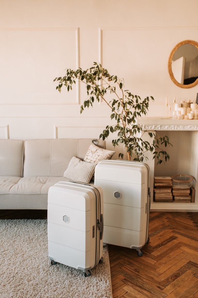 A stylish living room with packed luggage, ready for a travel adventure.