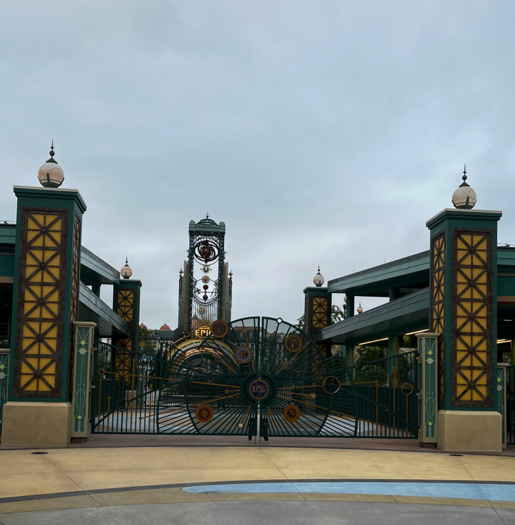 The gates outside of Epic Universe theme park on a cloudy day.