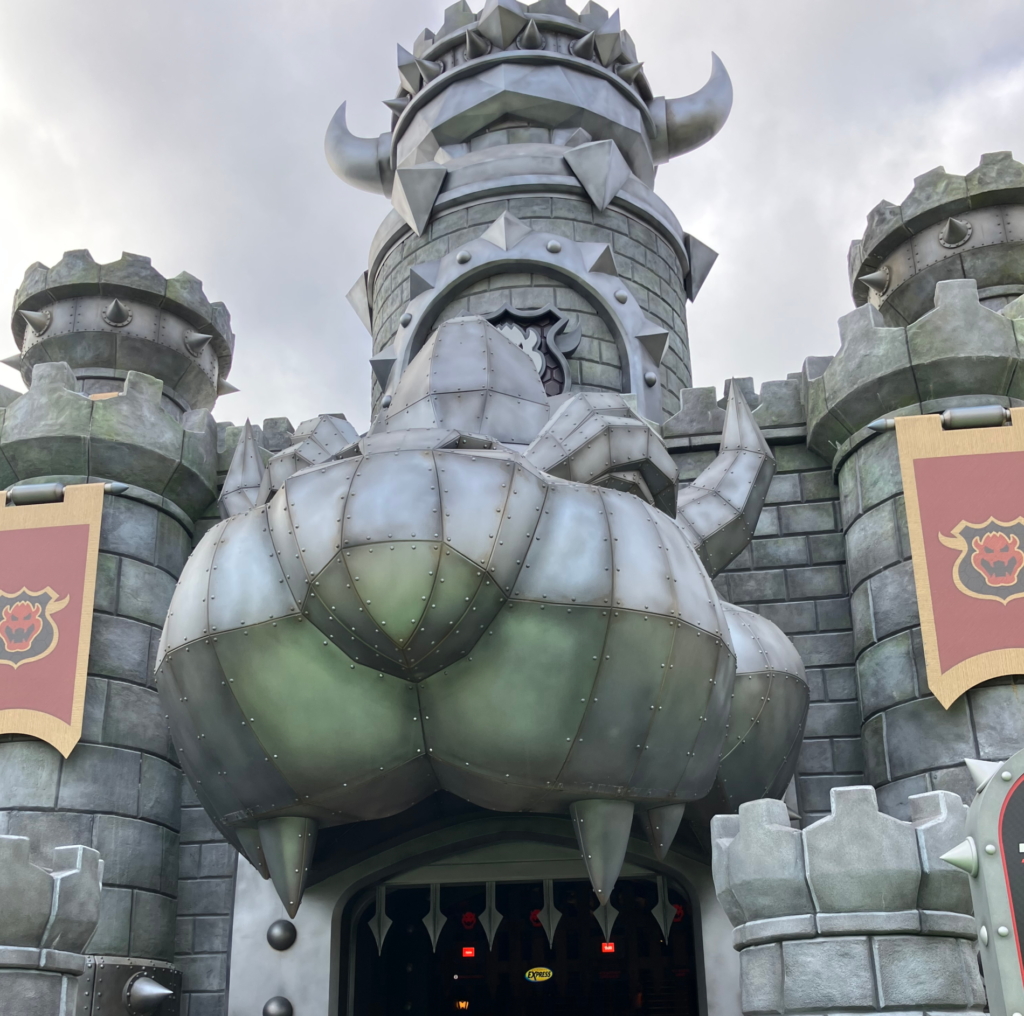 A grey castle with the face of Bowser from Nintendo