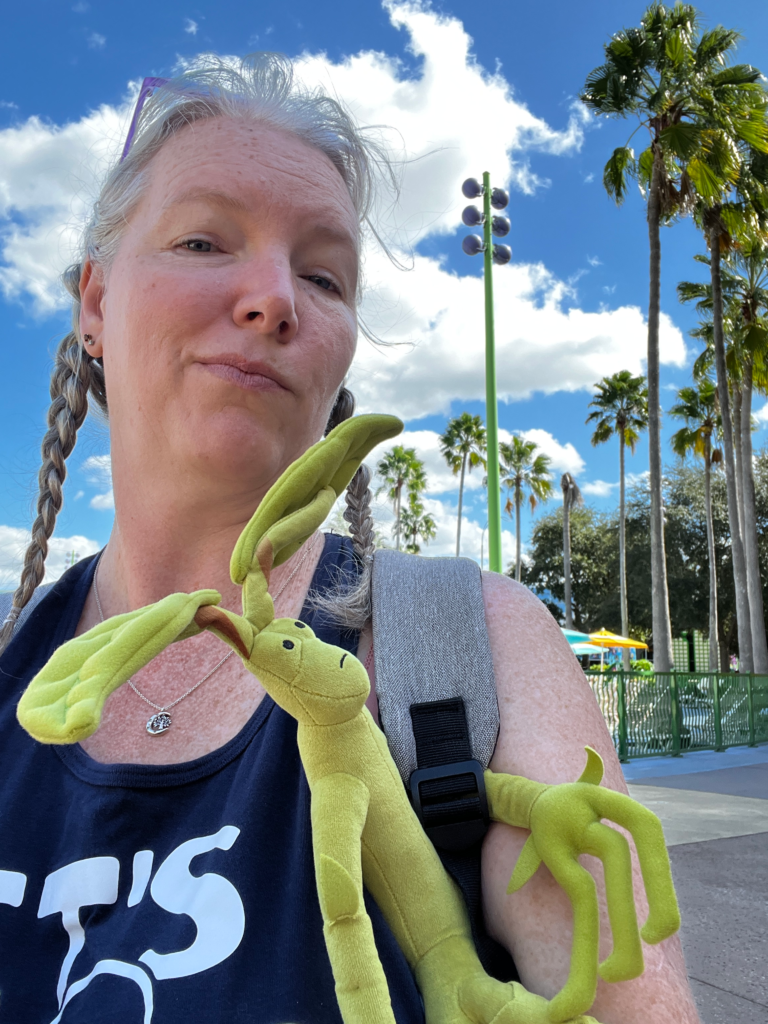 A woman has a bowtruckle plush toy