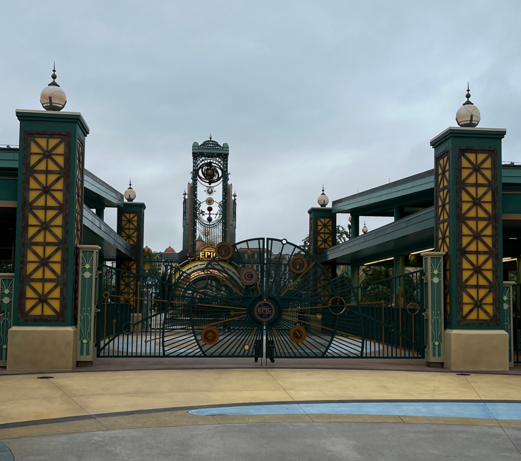 Green and gold gates at the entrance to Epic Universe.