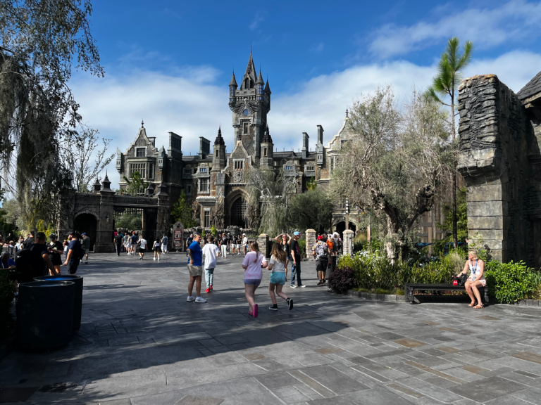 A gothic castle structure looms at the end of a stone path.